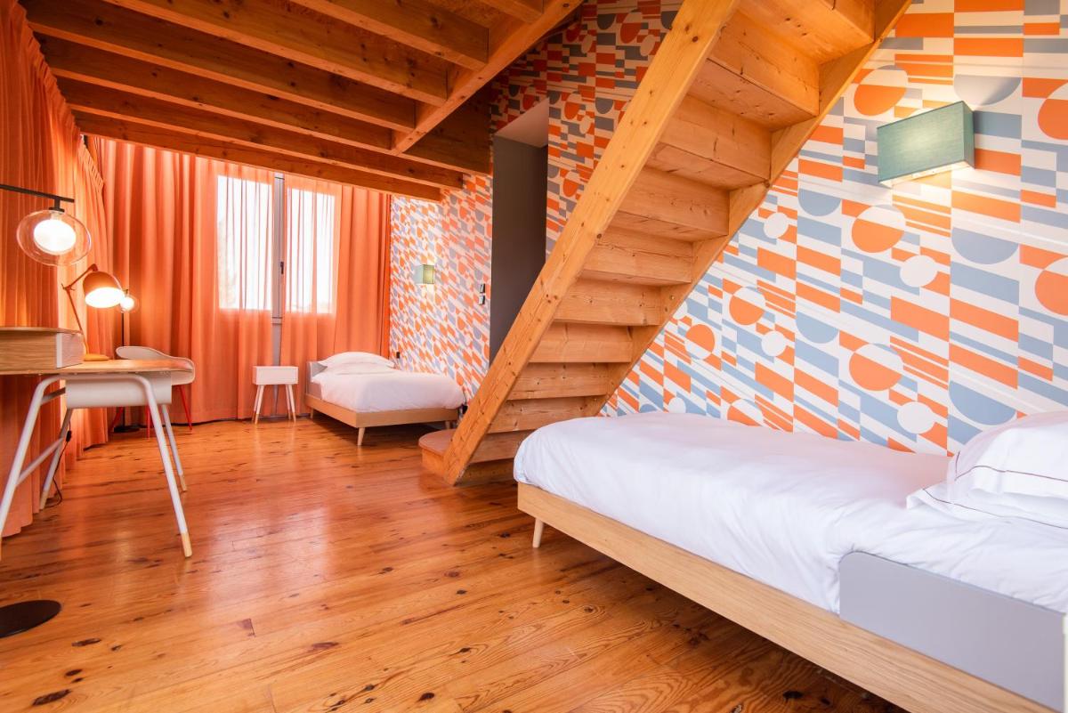 Un ou plusieurs lits dans un hébergement de l'établissement Hôtel Montmorency & Spa
