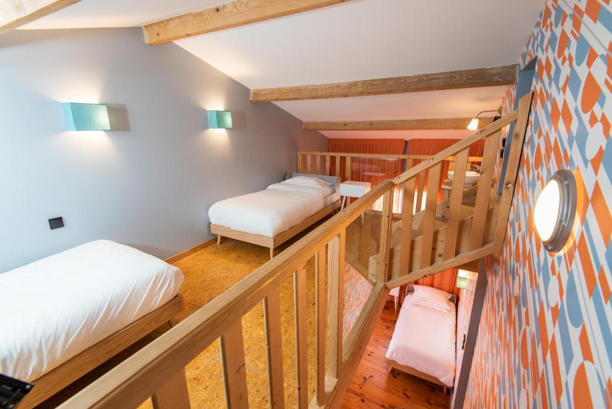 Un ou plusieurs lits dans un hébergement de l'établissement Hôtel Montmorency & Spa