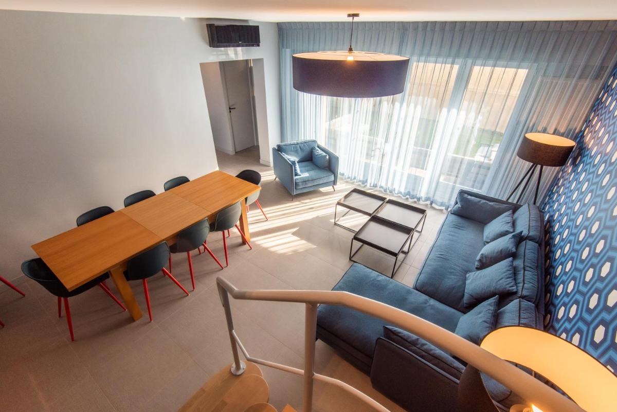 Coin salon dans l'établissement Hôtel Montmorency & Spa