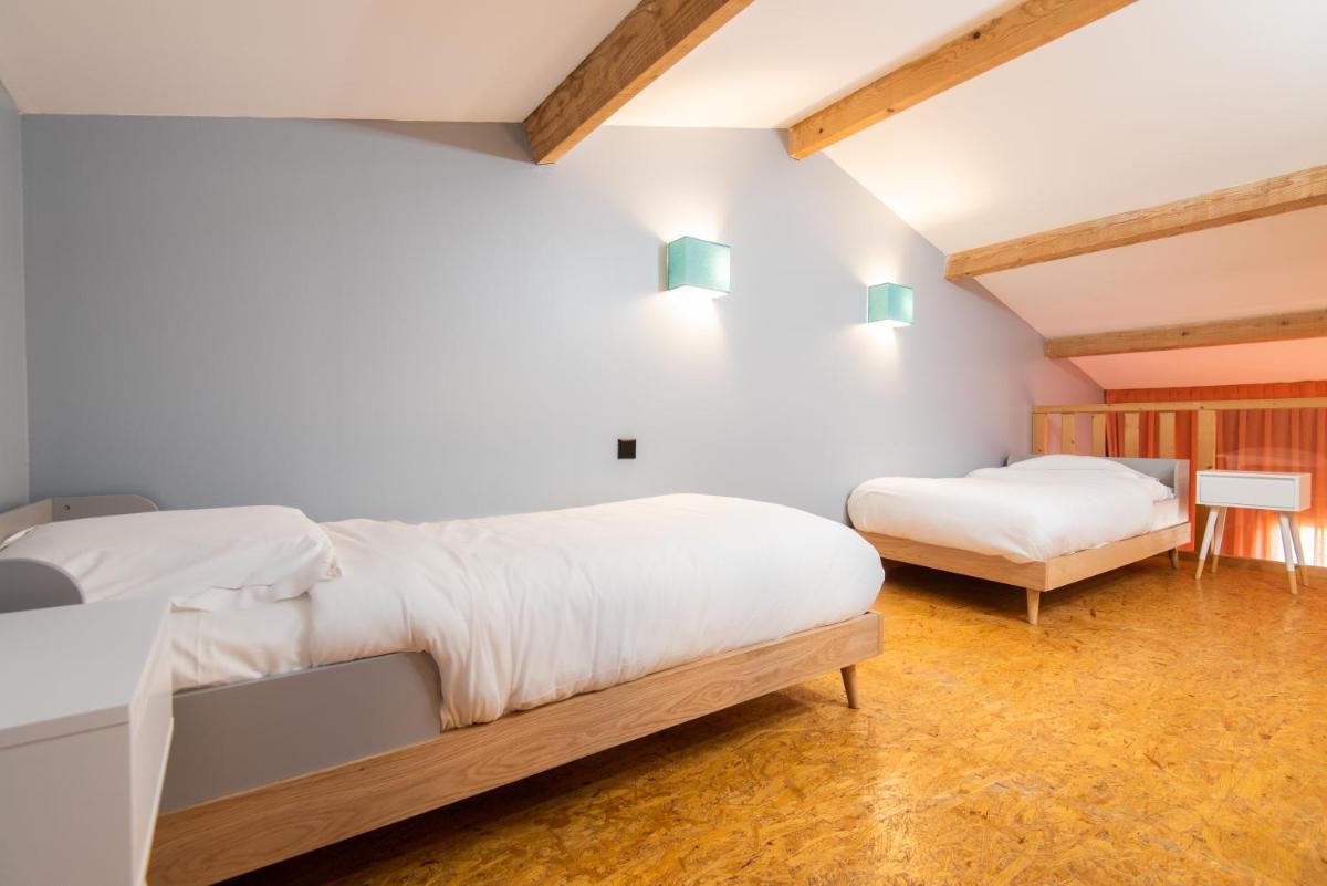 Un ou plusieurs lits dans un hébergement de l'établissement Hôtel Montmorency & Spa