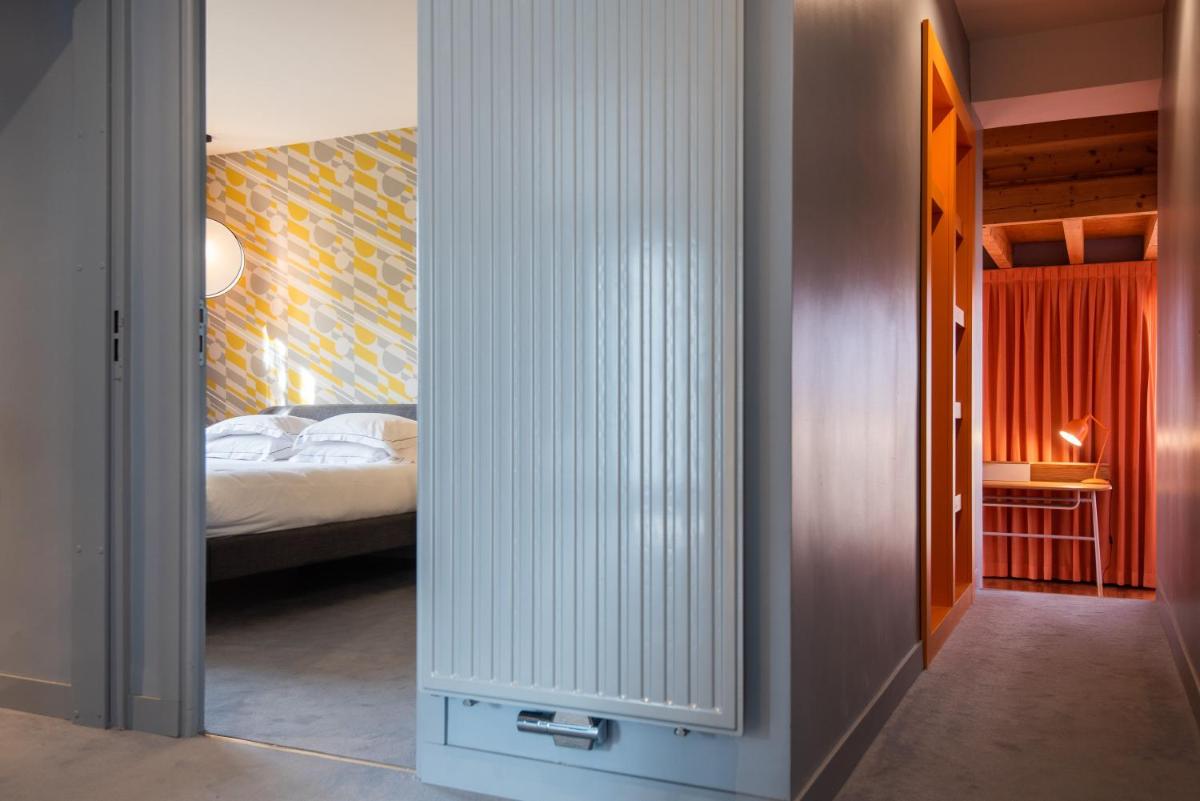 Un ou plusieurs lits dans un hébergement de l'établissement Hôtel Montmorency & Spa