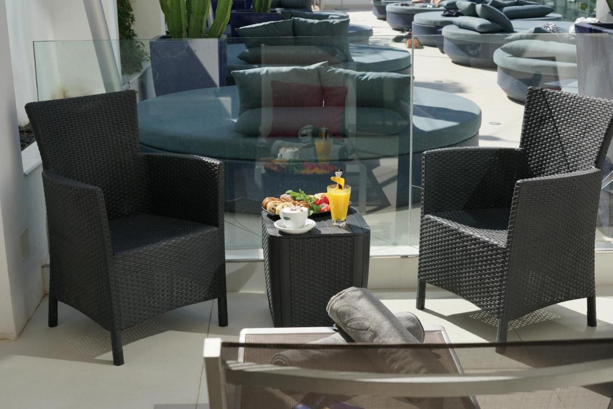 Zona de estar de Essence Hotel Boutique