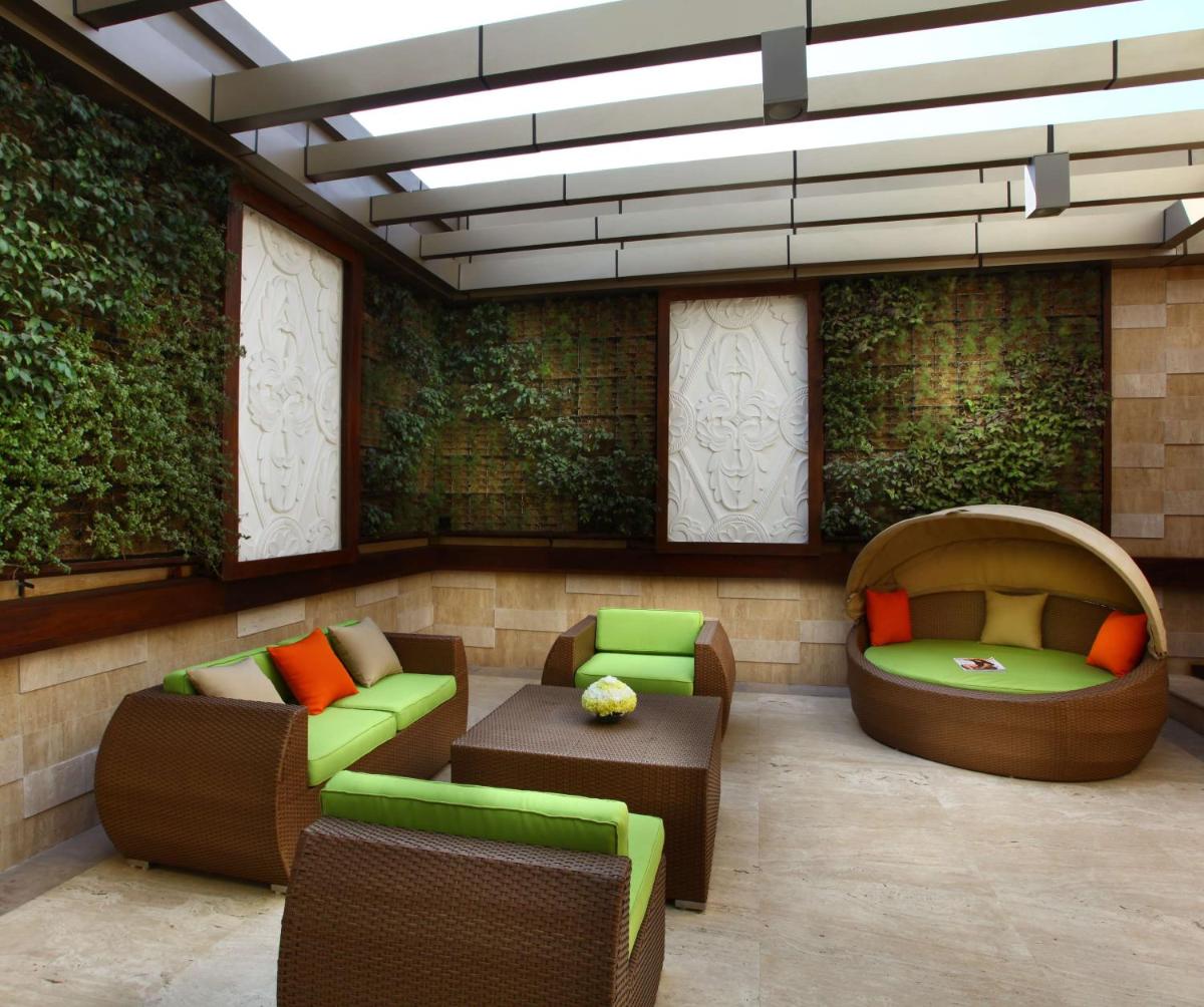 a living room with two chairs and a couch at Park Plaza Shahdara in New Delhi a living room with two chairs and a couch at Park Plaza Shahdara in New Delhi