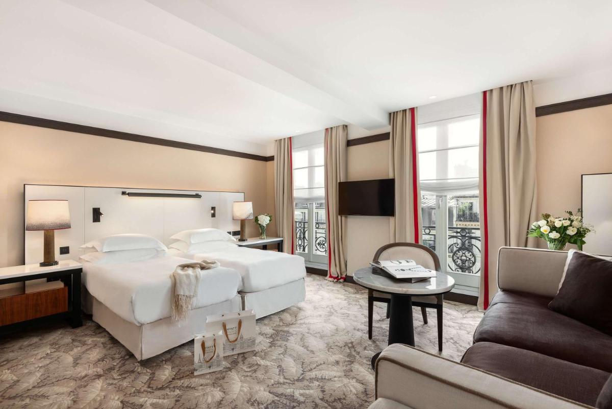 Un ou plusieurs lits dans un hébergement de l'établissement Hyatt Paris Madeleine