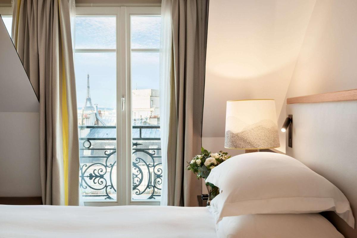 Un ou plusieurs lits dans un hébergement de l'établissement Hyatt Paris Madeleine