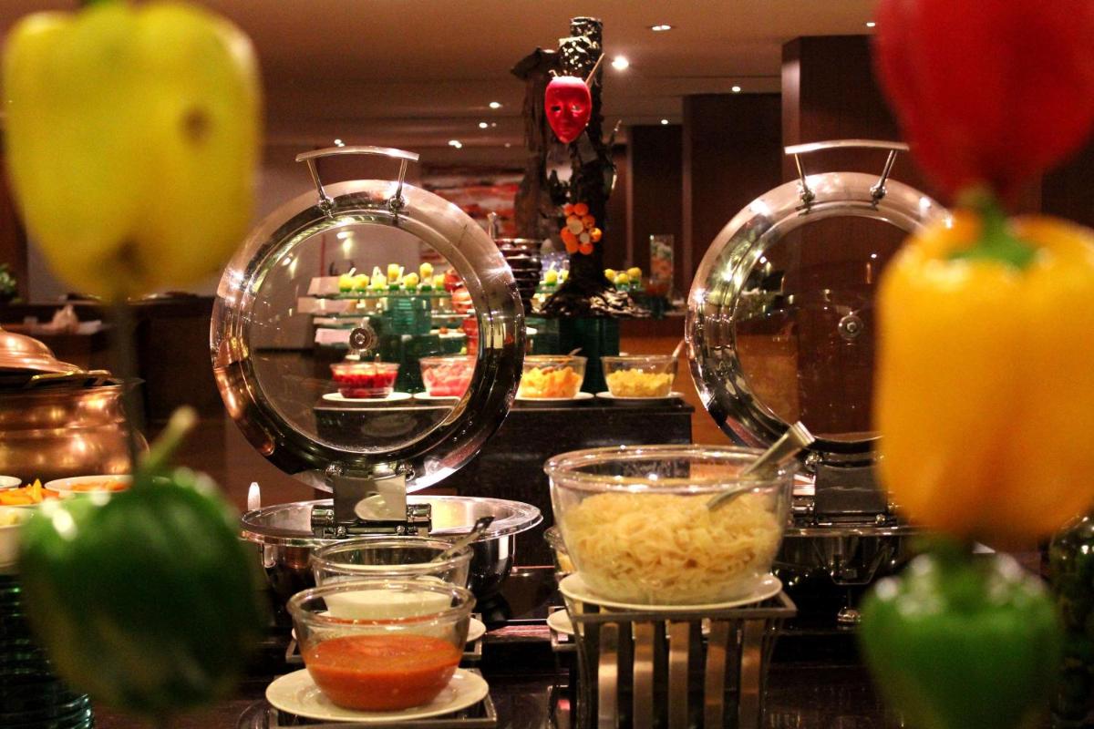 a kitchen with a food counter with some food ingrediants at Radisson Blu Plaza Hotel Hyderabad Banjara Hills in Hyderabad a kitchen with a food counter with some food ingrediants at Radisson Blu Plaza Hotel Hyderabad Banjara Hills in Hyderabad
