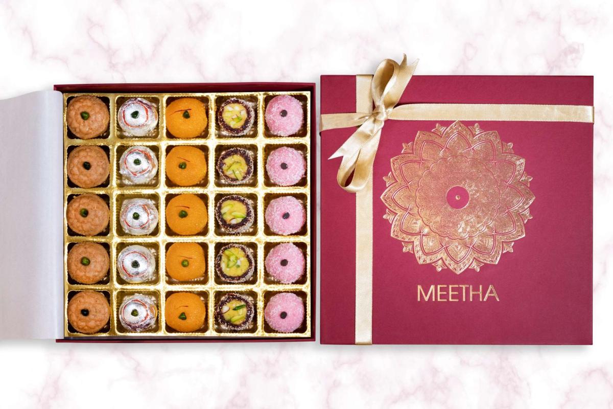 two boxes of iced donuts with a bow at Radisson Blu Plaza Hotel Hyderabad Banjara Hills in Hyderabad two boxes of iced donuts with a bow at Radisson Blu Plaza Hotel Hyderabad Banjara Hills in Hyderabad