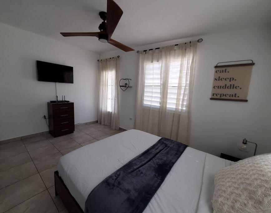 Aguadilla Sunset Apt AC WiFi 8 minute walk Crashboat Beach - Housity