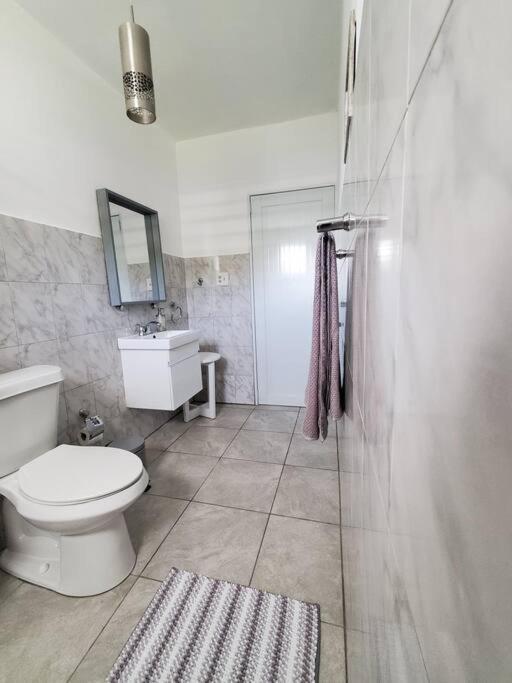 Aguadilla Sunset Apt AC WiFi 8 minute walk Crashboat Beach - Housity
