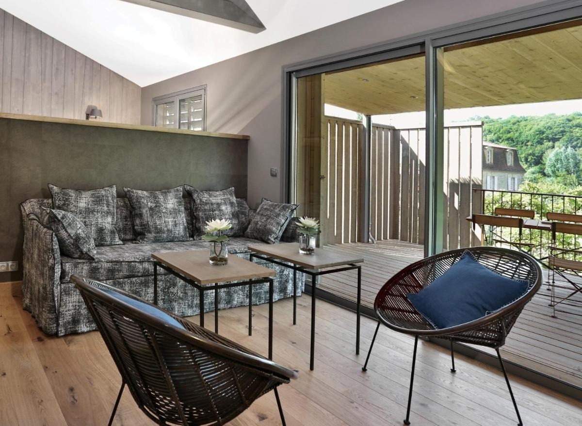 Coin salon dans l'établissement Les Glycines - Hôtel & Spa - Teritoria