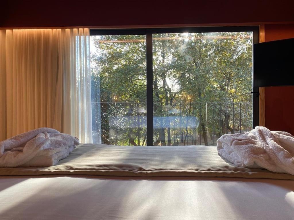 Uma cama ou camas num quarto em Quinta do Pedregal Hotel & Spa