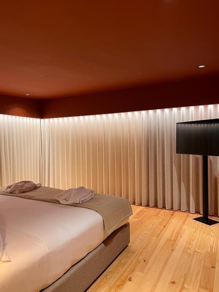 Uma cama ou camas num quarto em Quinta do Pedregal Hotel & Spa