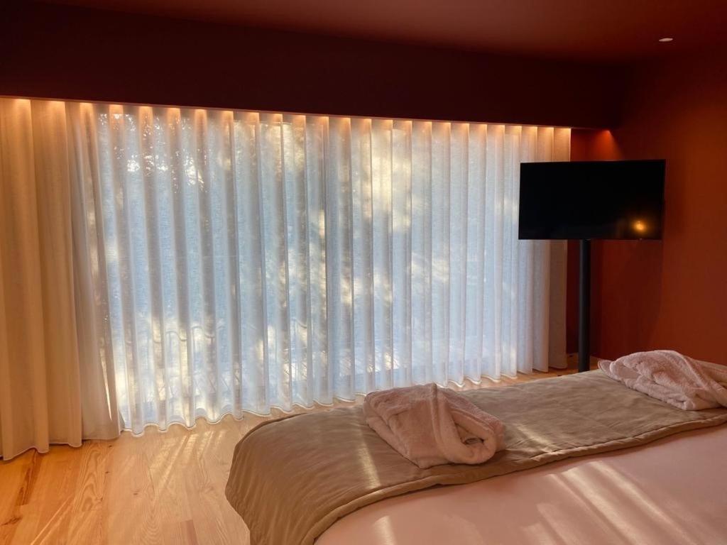 Uma cama ou camas num quarto em Quinta do Pedregal Hotel & Spa