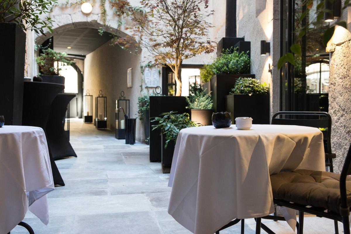 Restaurant ou autre lieu de restauration dans l'établissement Petit Hôtel Confidentiel