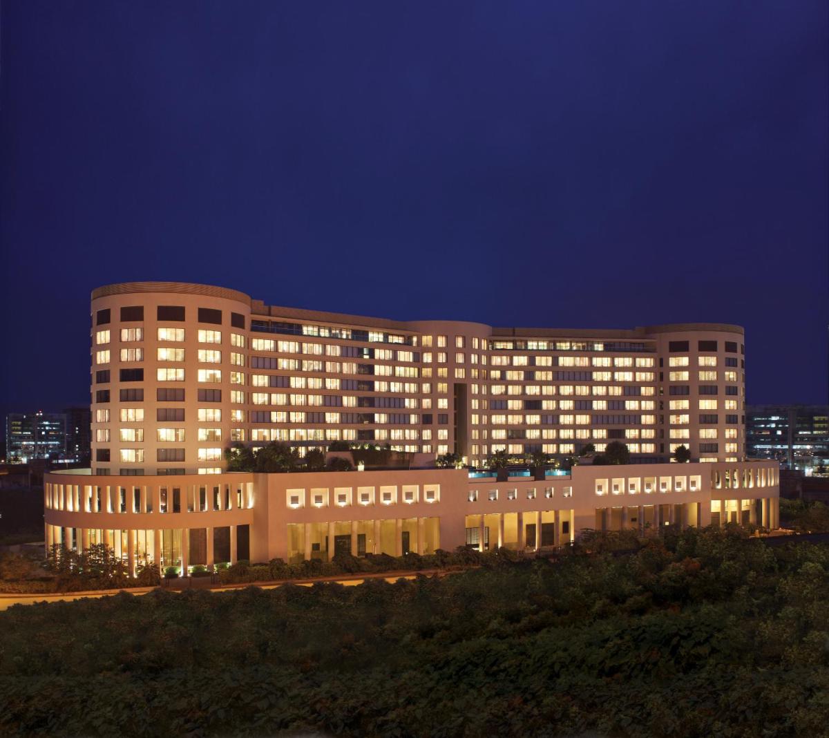 a large building with lights on at night at Trident Bandra Kurla in Mumbai a large building with lights on at night at Trident Bandra Kurla in Mumbai