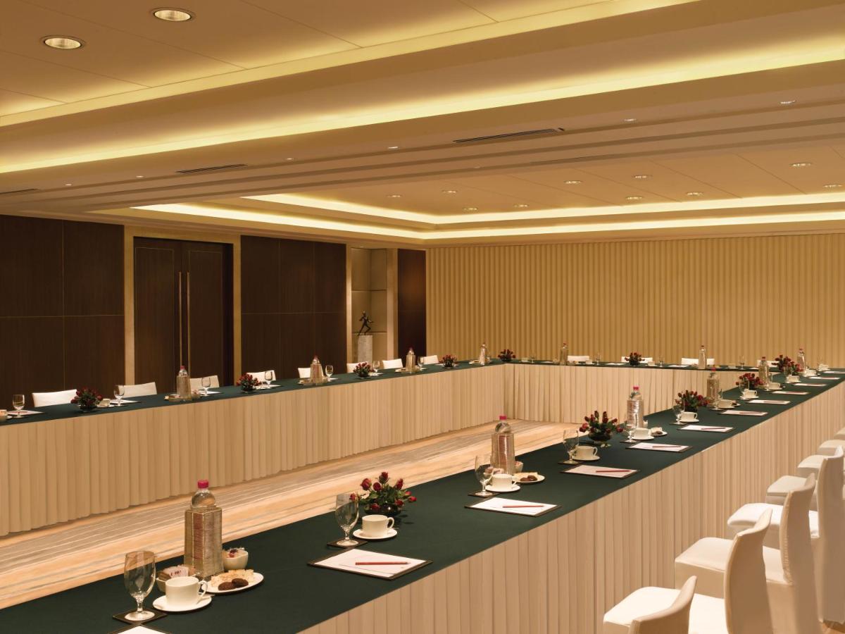 a large conference room with tables and chairs at Trident Bandra Kurla in Mumbai a large conference room with tables and chairs at Trident Bandra Kurla in Mumbai