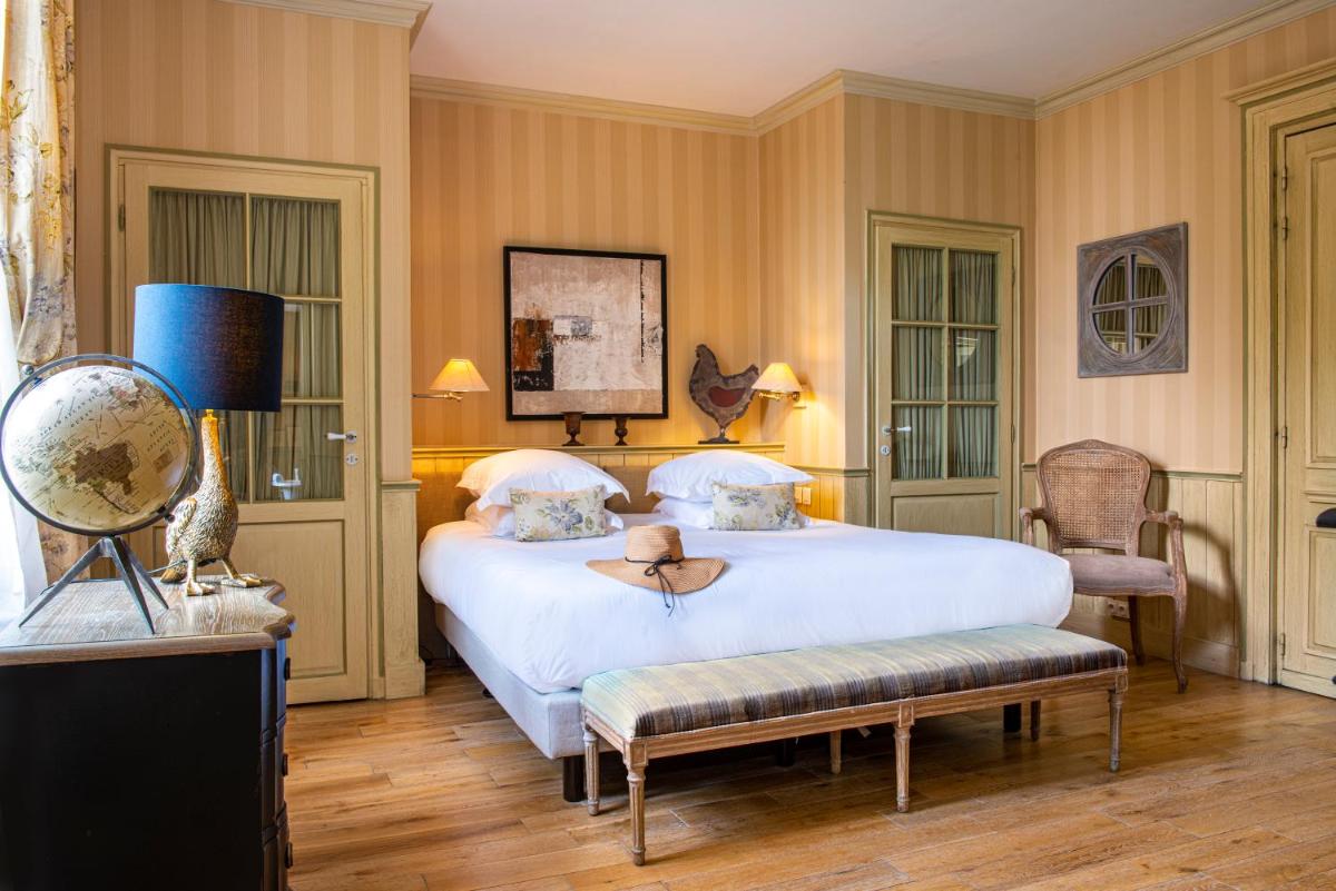 Un ou plusieurs lits dans un hébergement de l'établissement Château de Courban and Spa Nuxe