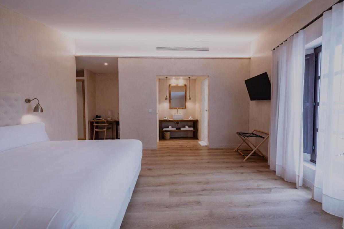 Cama o camas de una habitación en Hotel Palau Macelli & Spa