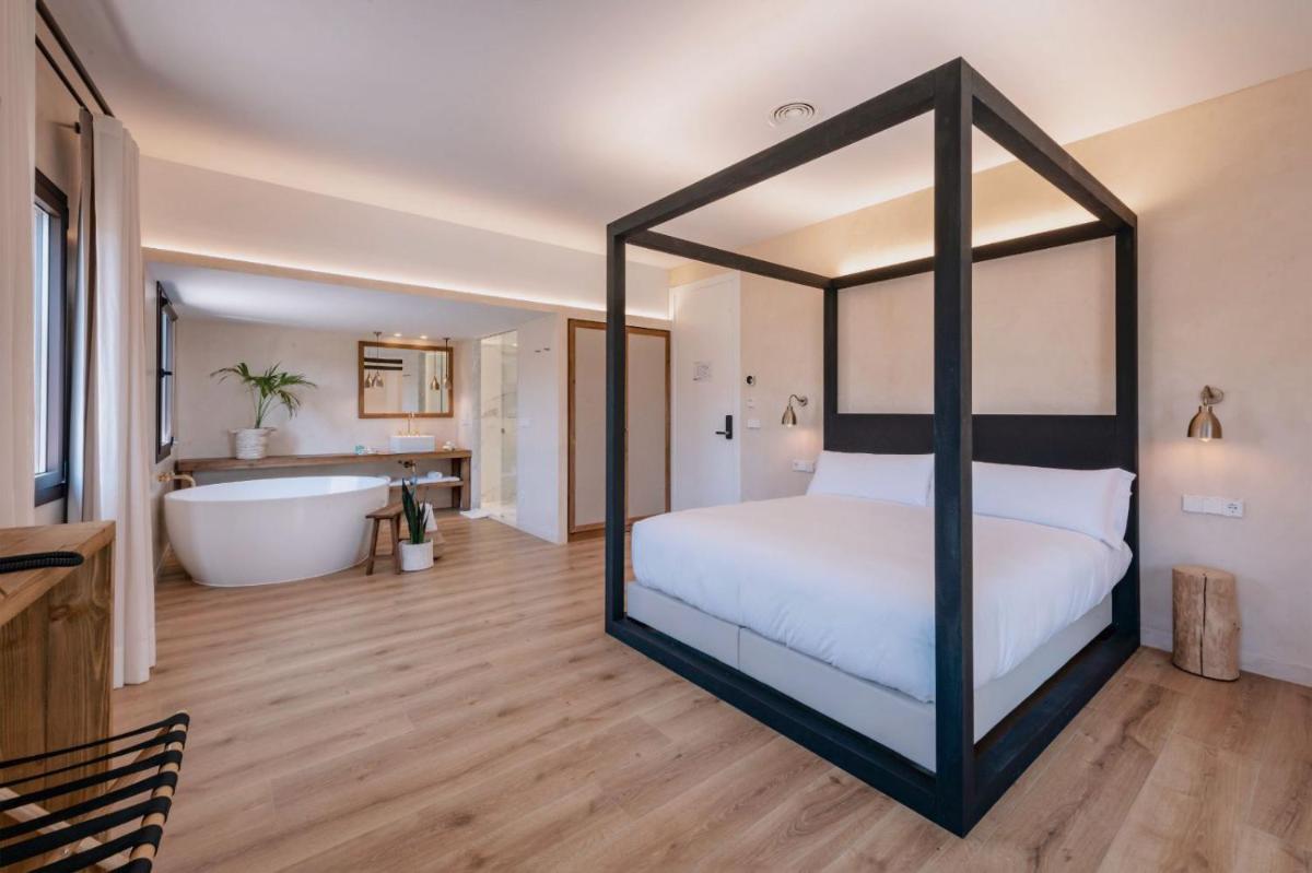 Cama o camas de una habitación en Hotel Palau Macelli & Spa