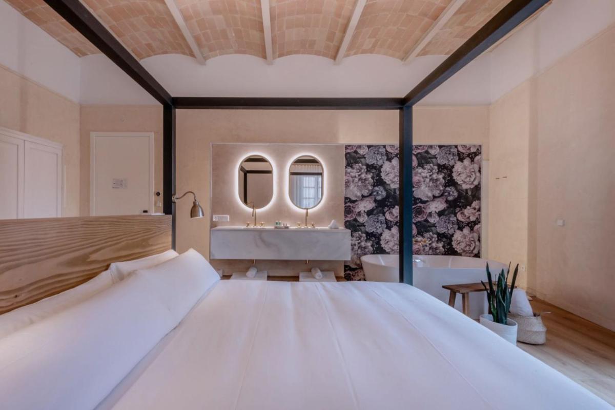 Cama o camas de una habitación en Hotel Palau Macelli & Spa