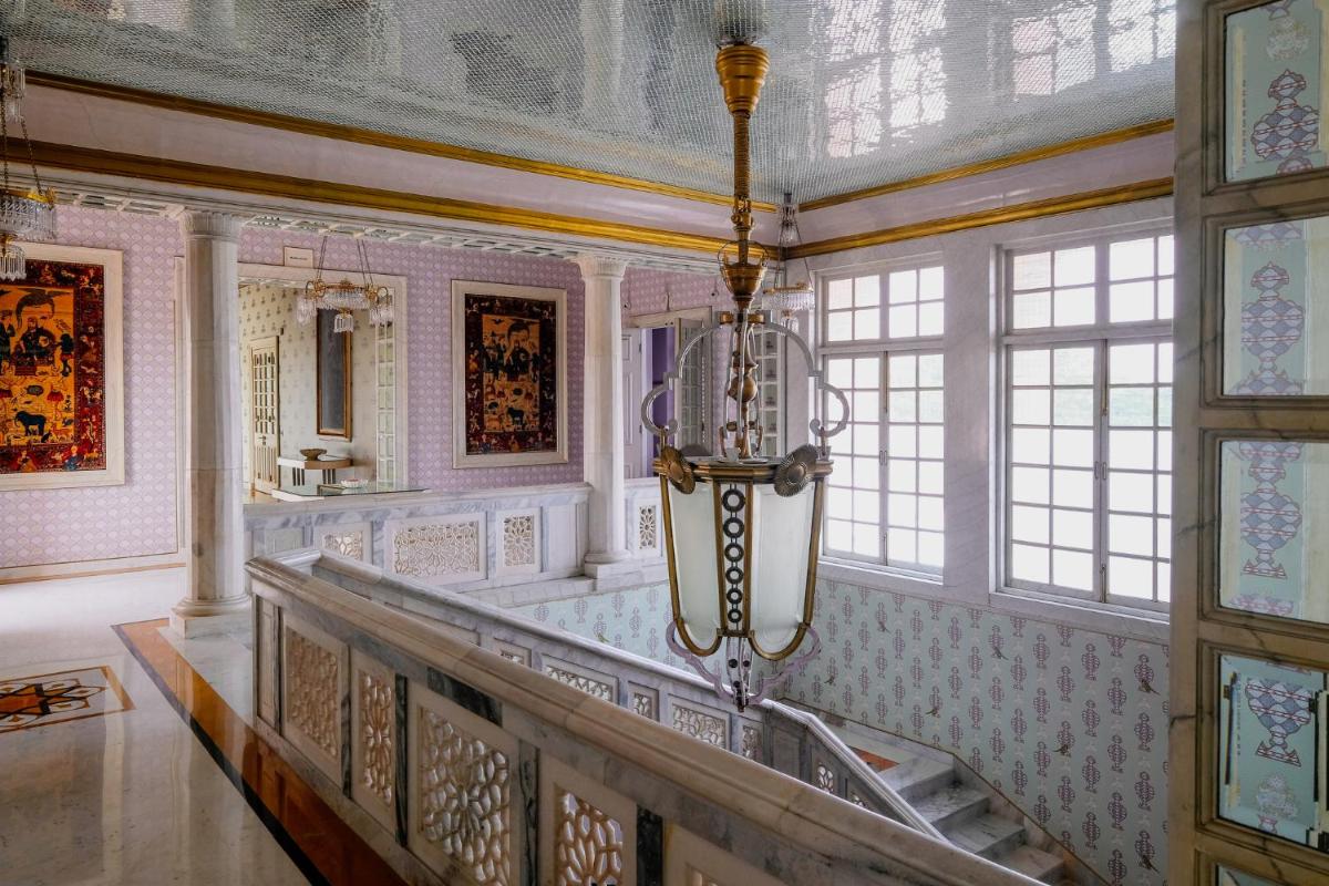 a large room with a chandelier in a building at Rajmahal Palace RAAS in Jaipur