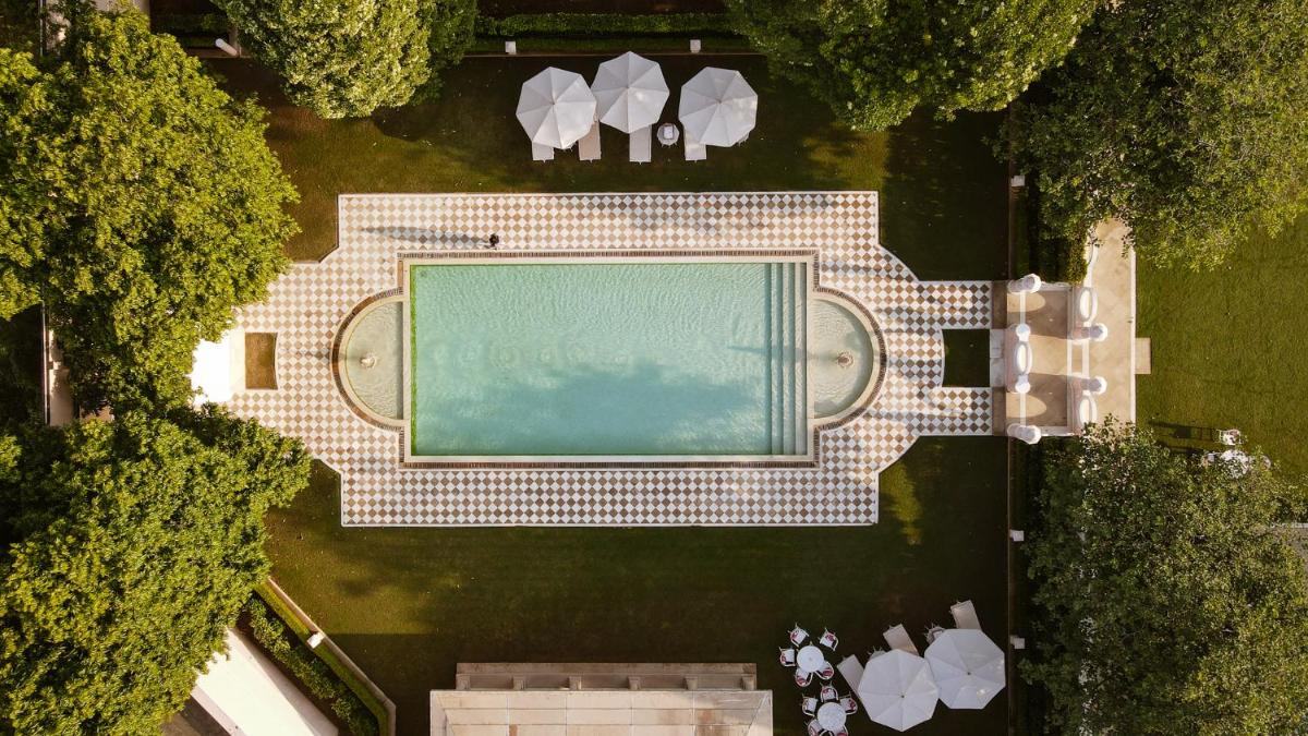 an overhead view of a swimming pool in a park at Rajmahal Palace RAAS in Jaipur