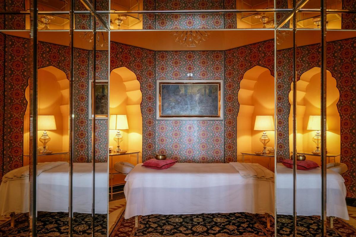 a bedroom with two bunk beds in a room at Rajmahal Palace RAAS in Jaipur