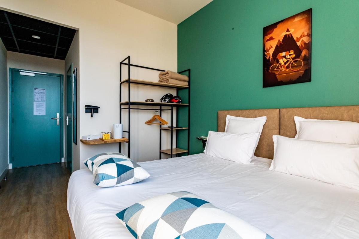 Un ou plusieurs lits dans un hébergement de l'établissement Le Nesk Ventoux - Hotel