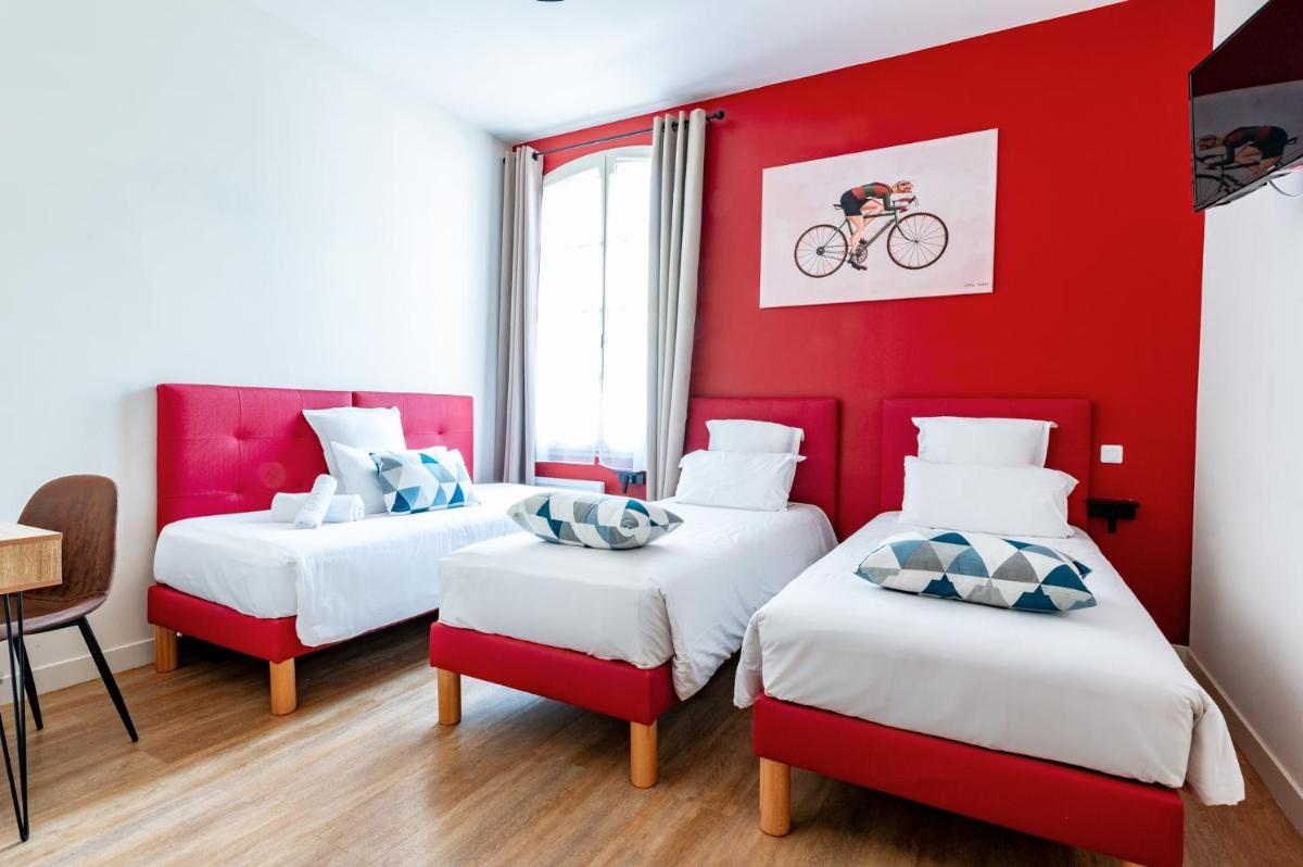 Un ou plusieurs lits dans un hébergement de l'établissement Le Nesk Ventoux - Hotel