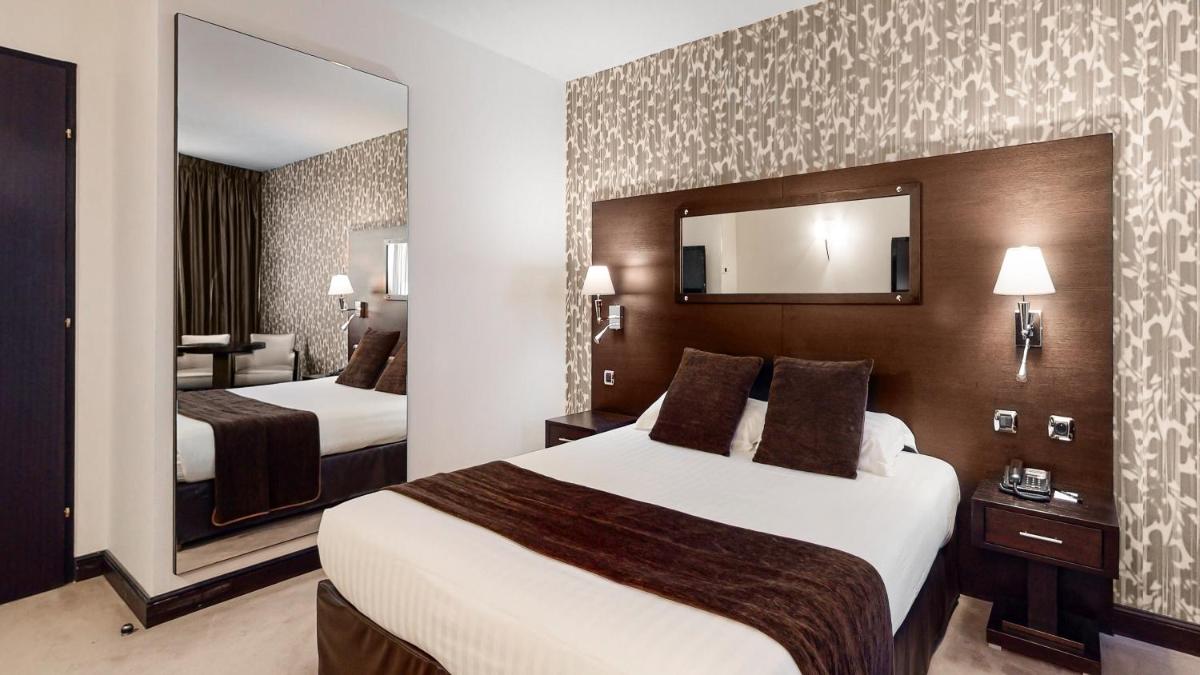 Un ou plusieurs lits dans un hébergement de l'établissement Hotel Palladia