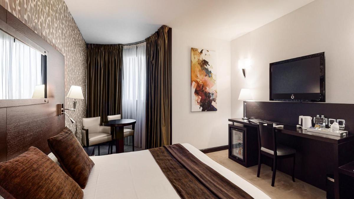 Télévision ou salle de divertissement dans l'établissement Hotel Palladia