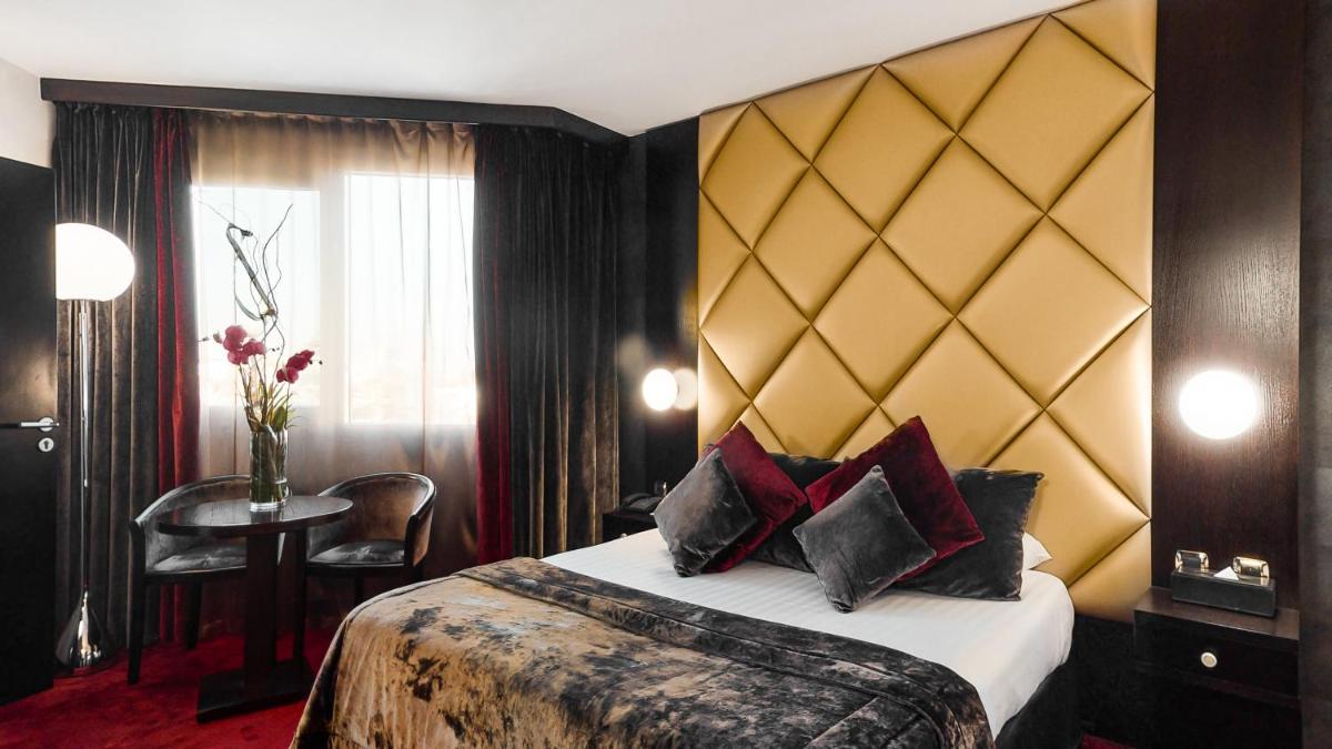 Un ou plusieurs lits dans un hébergement de l'établissement Hotel Palladia