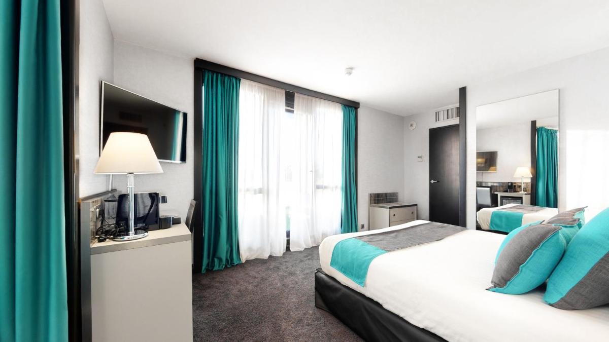 Un ou plusieurs lits dans un hébergement de l'établissement Hotel Palladia
