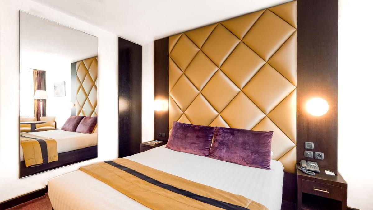 Un ou plusieurs lits dans un hébergement de l'établissement Hotel Palladia