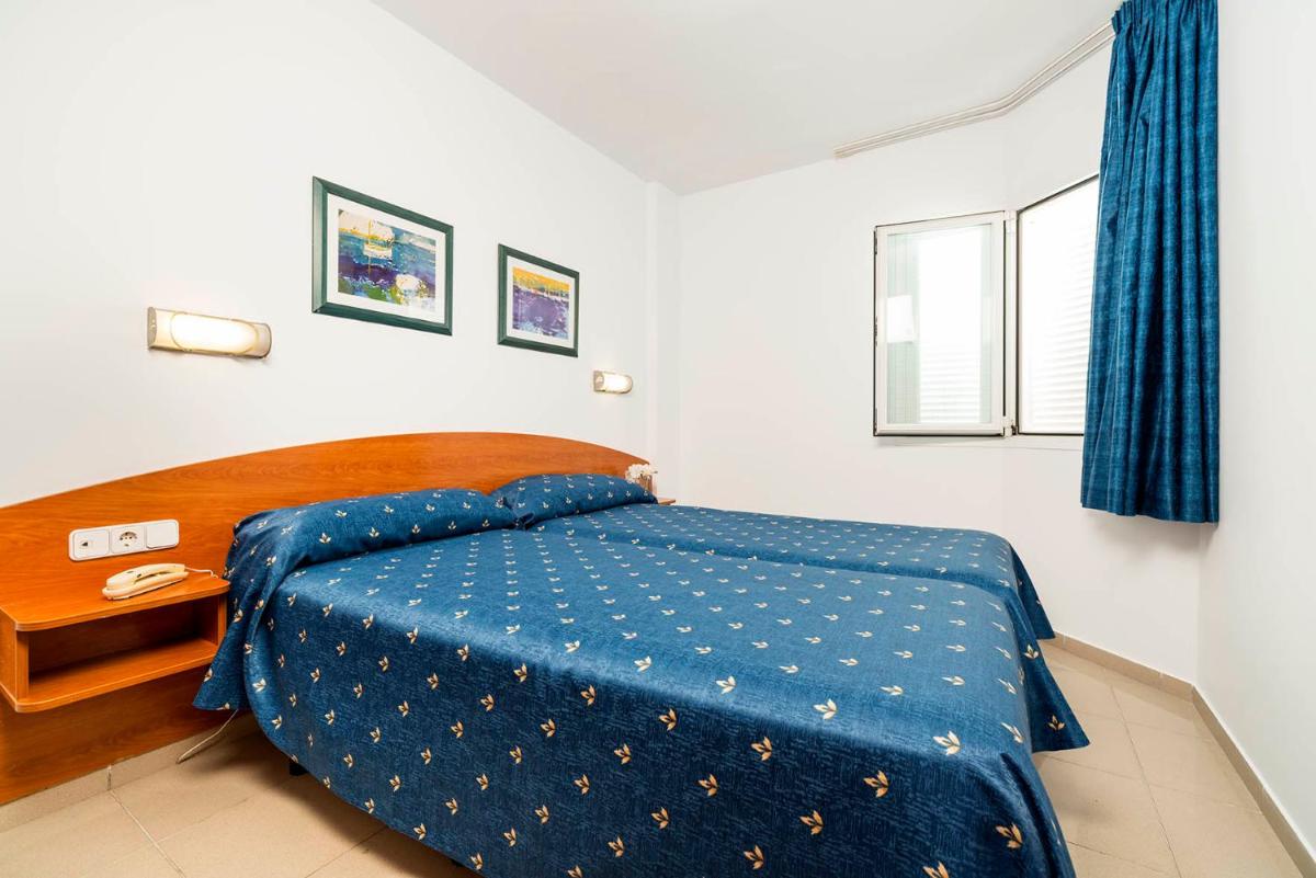 Cama o camas de una habitación en Aparthotel Costa Encantada