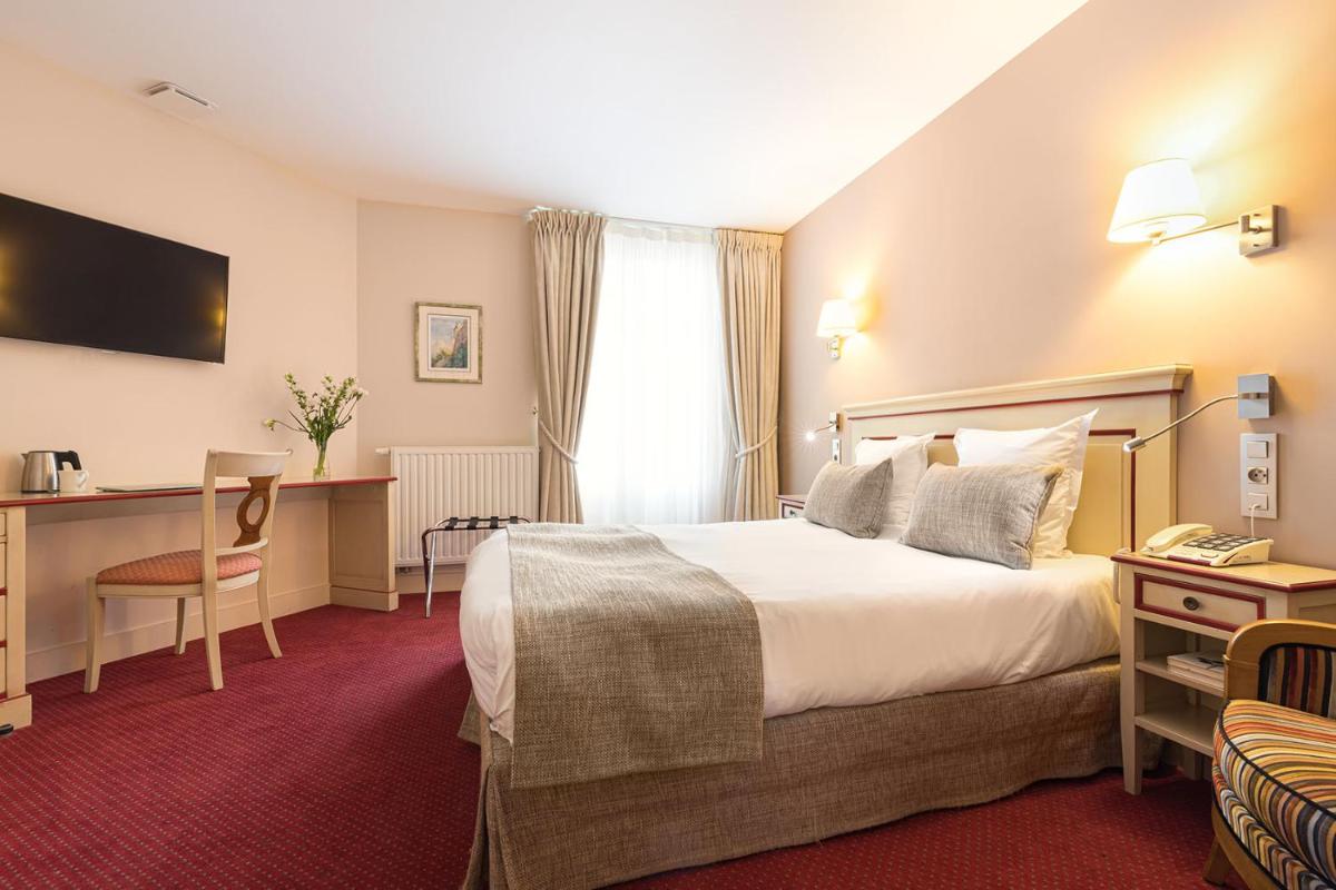 Un ou plusieurs lits dans un hébergement de l'établissement Hôtel Spa Thermalia