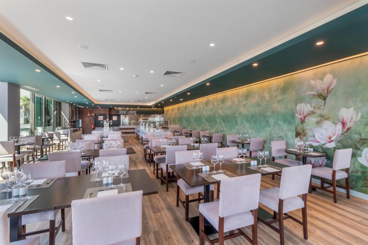Um restaurante ou outro lugar para comer em Enotel Magnólia