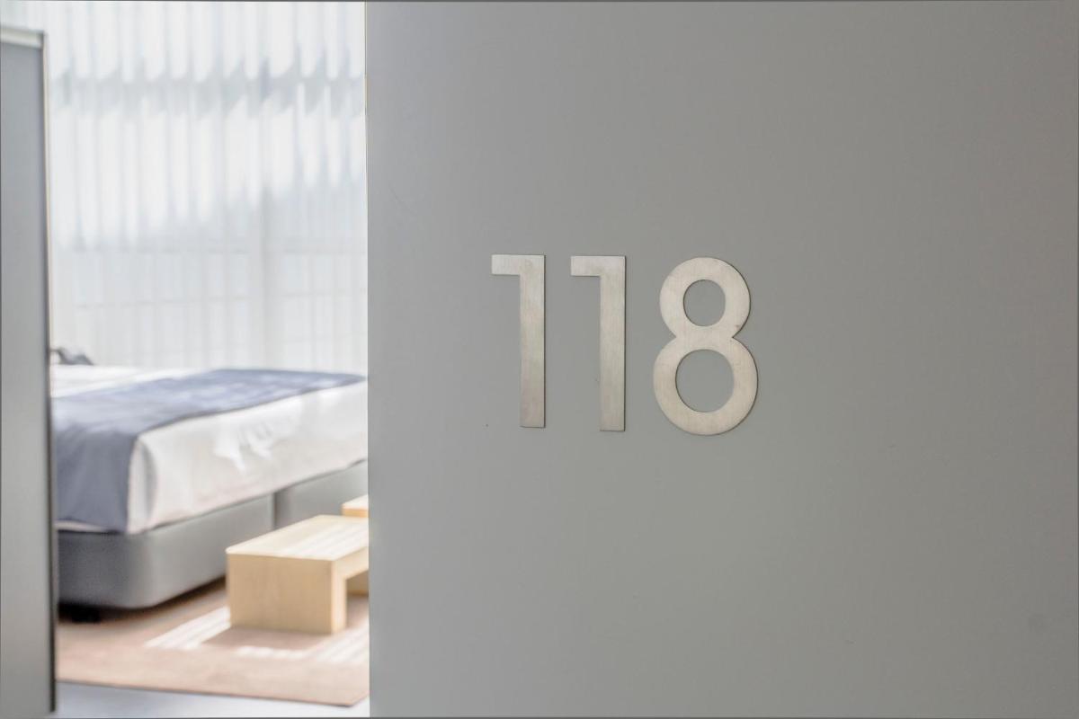 Uma cama ou camas num quarto em Boticas Hotel Art & SPA