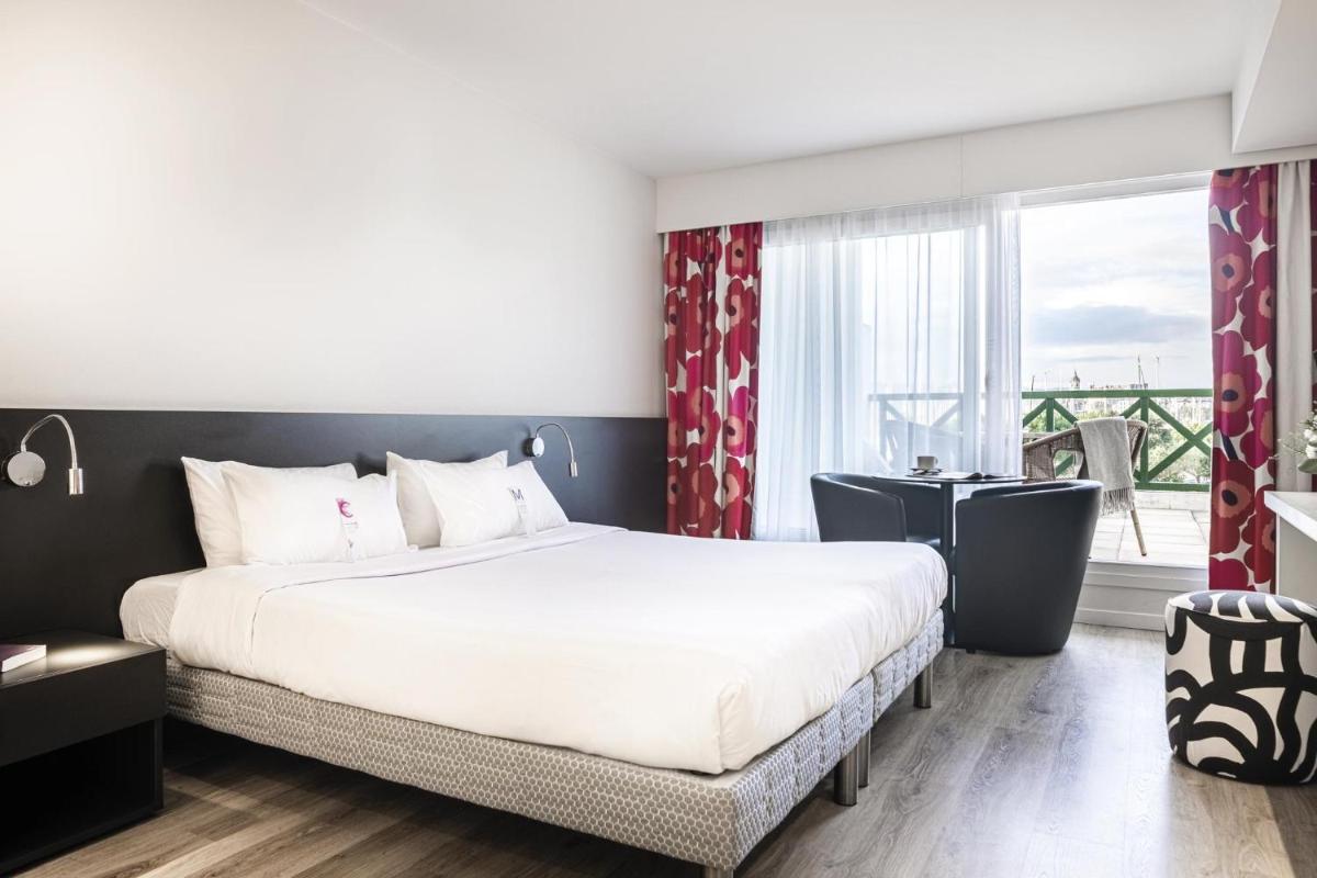 Un ou plusieurs lits dans un hébergement de l'établissement Hôtel Serge Blanco - Relais Thalasso & Spa