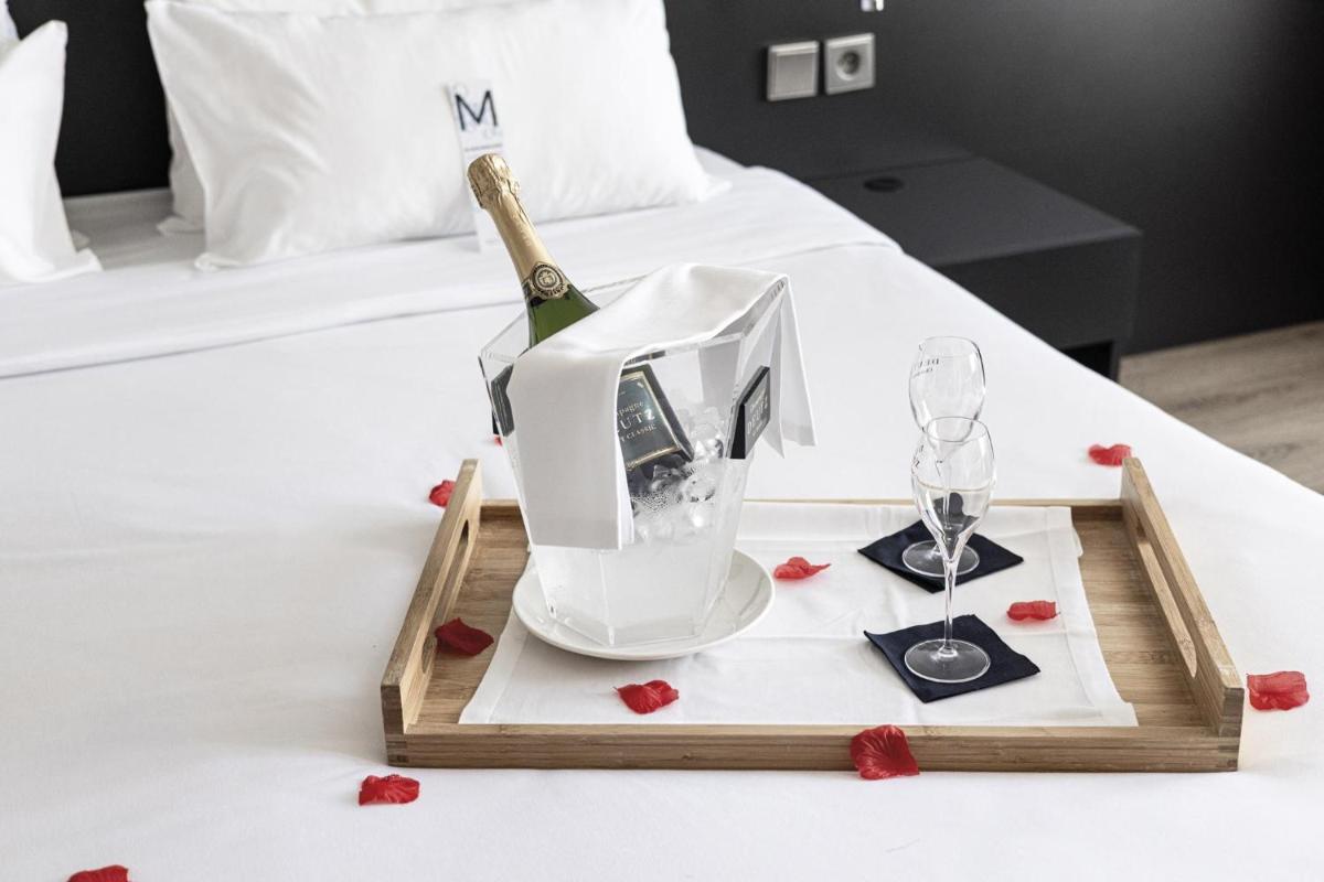 Un ou plusieurs lits dans un hébergement de l'établissement Hôtel Serge Blanco - Relais Thalasso & Spa