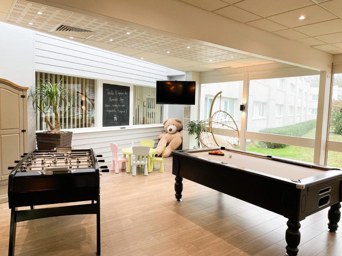 Télévision ou salle de divertissement dans l'établissement Novotel Fontainebleau Ury