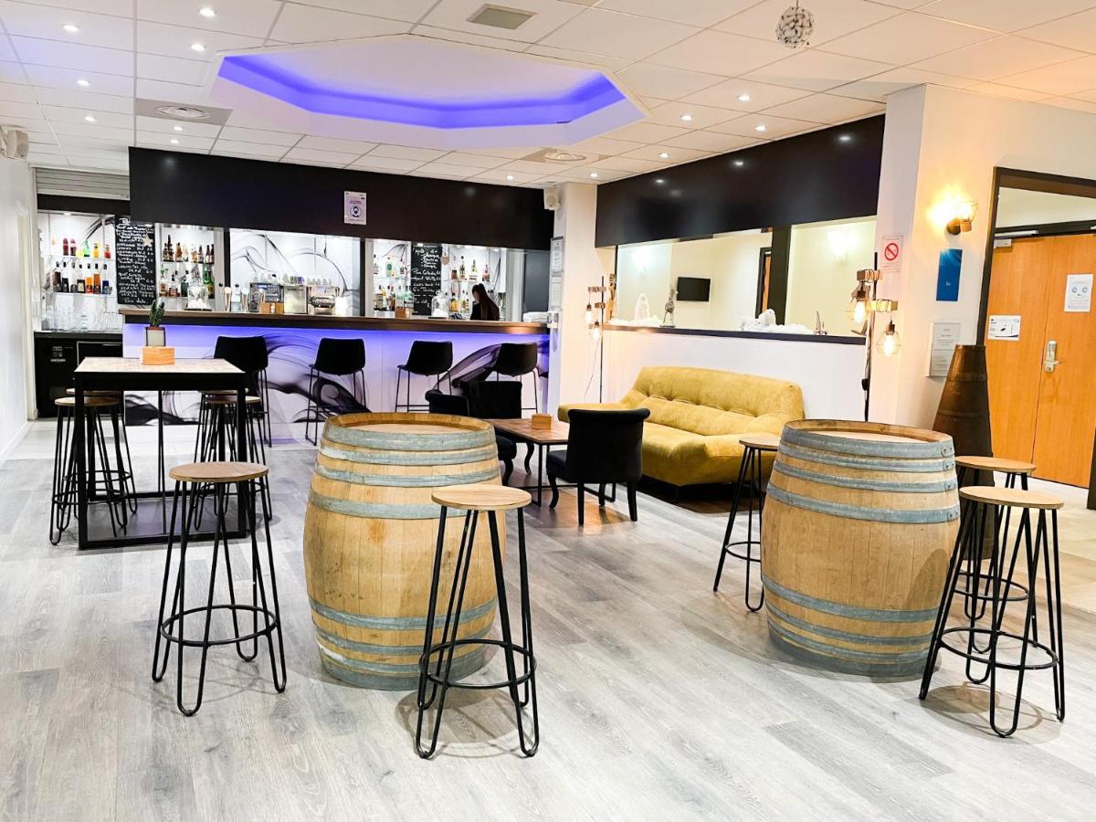 Coin salon dans l'établissement Novotel Fontainebleau Ury