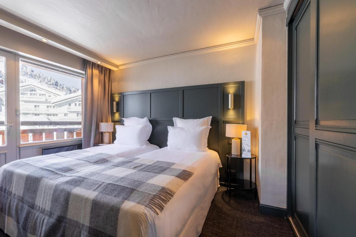 Un ou plusieurs lits dans un hébergement de l'établissement Grand Hôtel Courchevel 1850