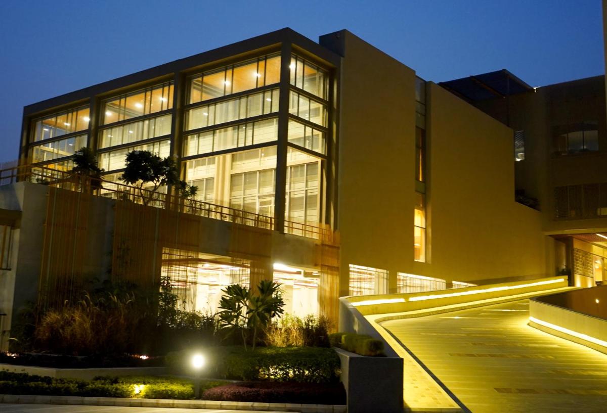 a large building with a lot of windows at night at The Centrum in Lucknow