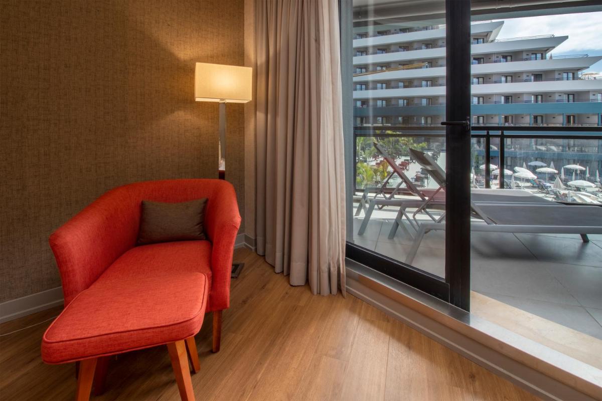 Uma área de estar em Enotel Lido - All Inclusive