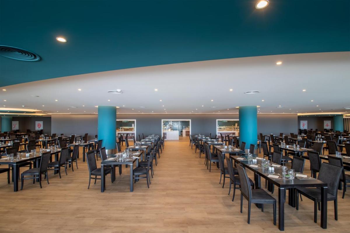 Um restaurante ou outro lugar para comer em Enotel Lido - All Inclusive