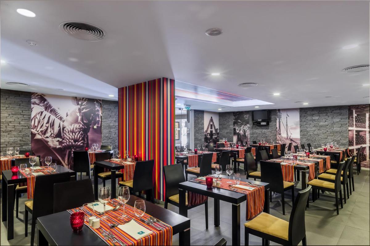 Um restaurante ou outro lugar para comer em Enotel Lido - All Inclusive