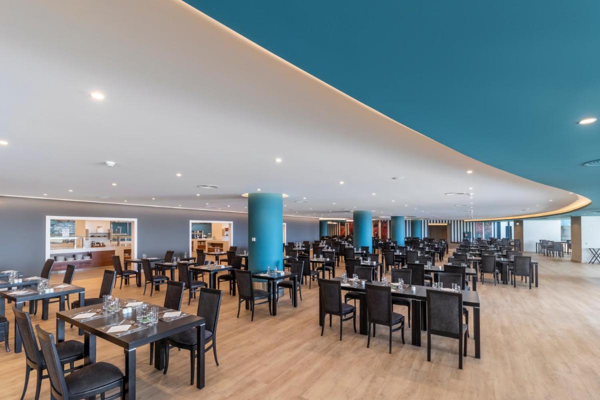 Um restaurante ou outro lugar para comer em Enotel Lido - All Inclusive