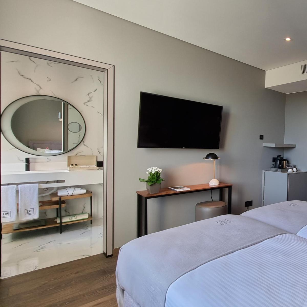 Uma cama ou camas num quarto em DS Hotel Lusopark