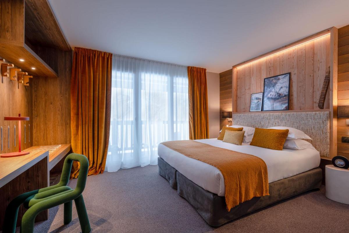 Un ou plusieurs lits dans un hébergement de l'établissement ILY Hotels & Spa La Rosiere